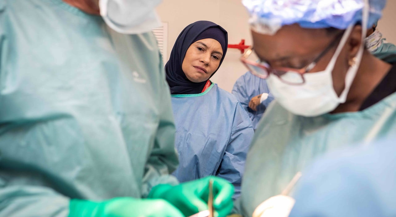 DSV representative viewing a cleft lip surgery done by Operation Smile volunteers